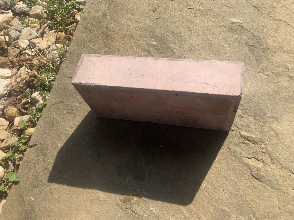Brick With Winged Wheel Design