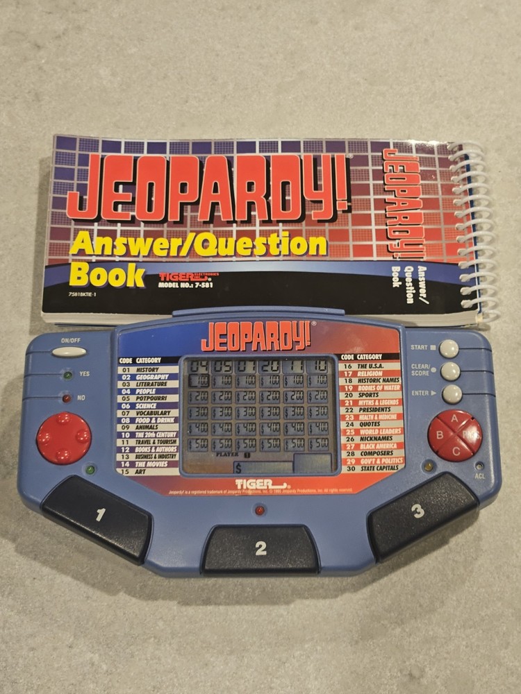 Tiger Electronics Jeopardy Hand Held Game 1995 with Answer Question Book