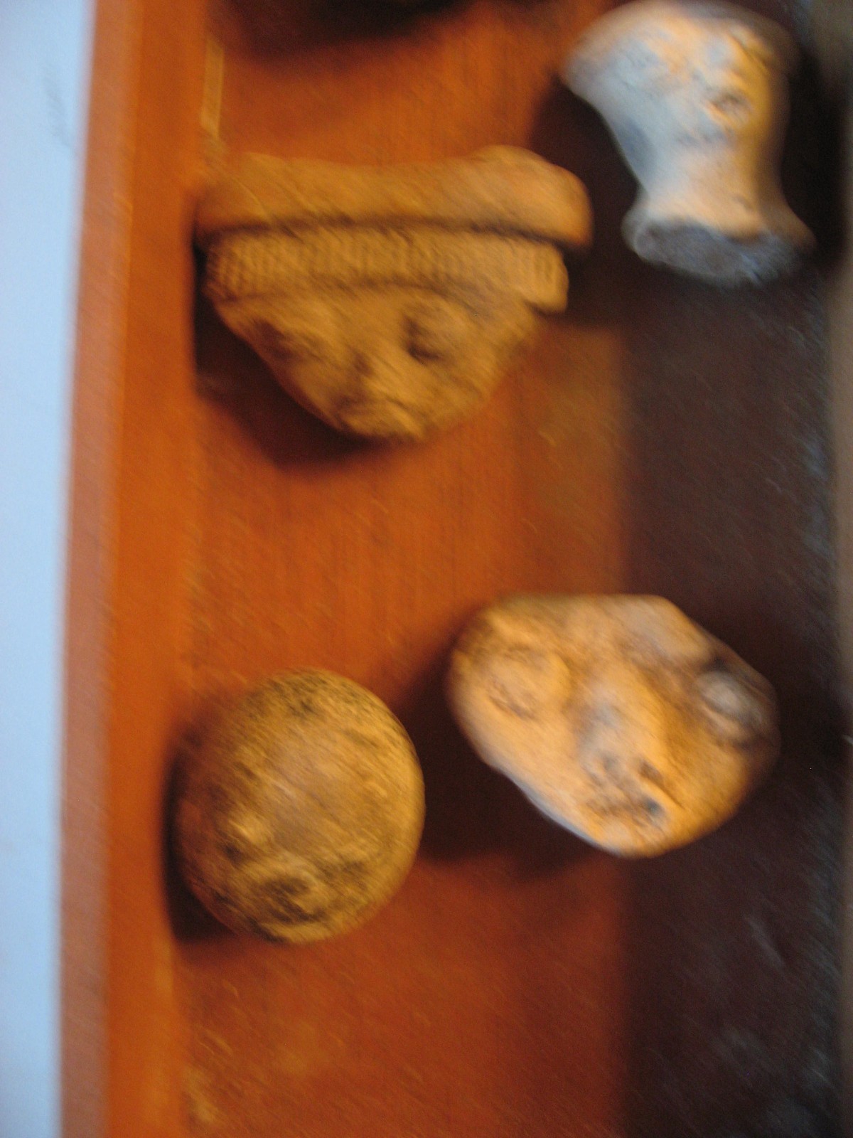Antique Pre-Columbian Artifacts Box of 12 Hand Carved Stone Face Heads on Wood