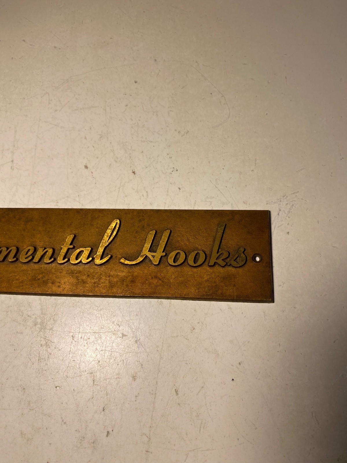 Vintage Metal Ornamental Hooks Sign Plaque