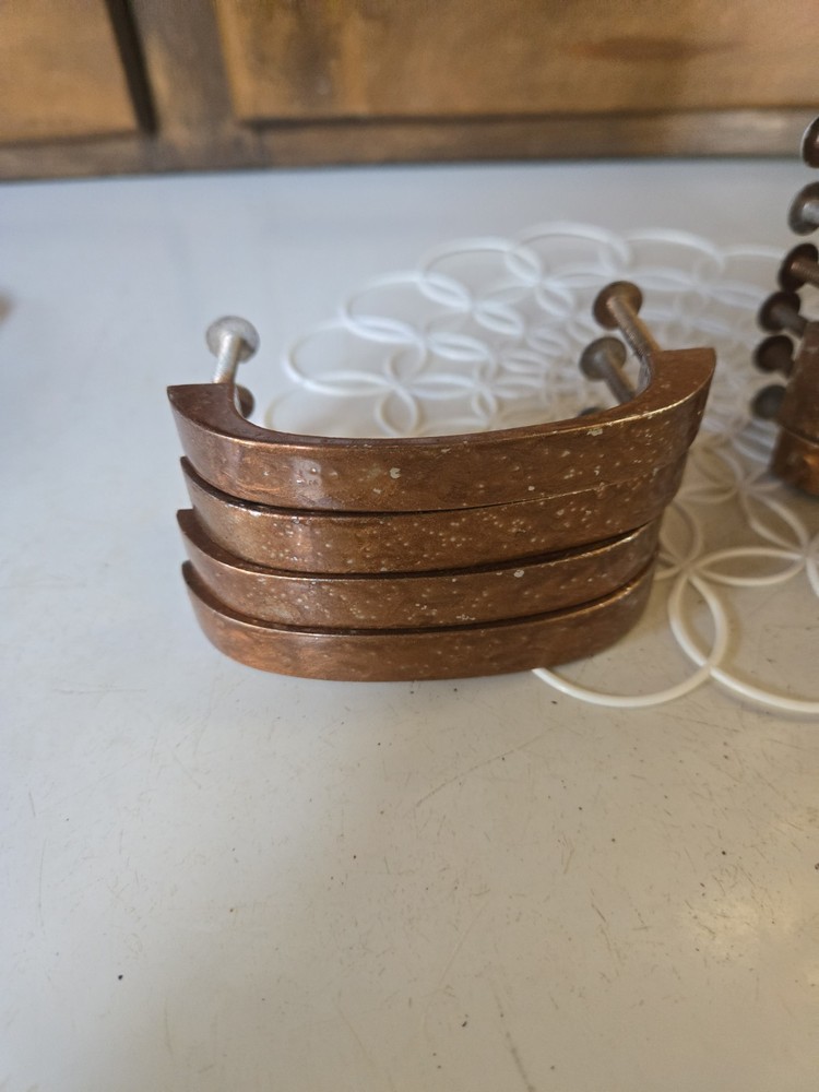 Antique copper metal door pulls with hammered texture finish.