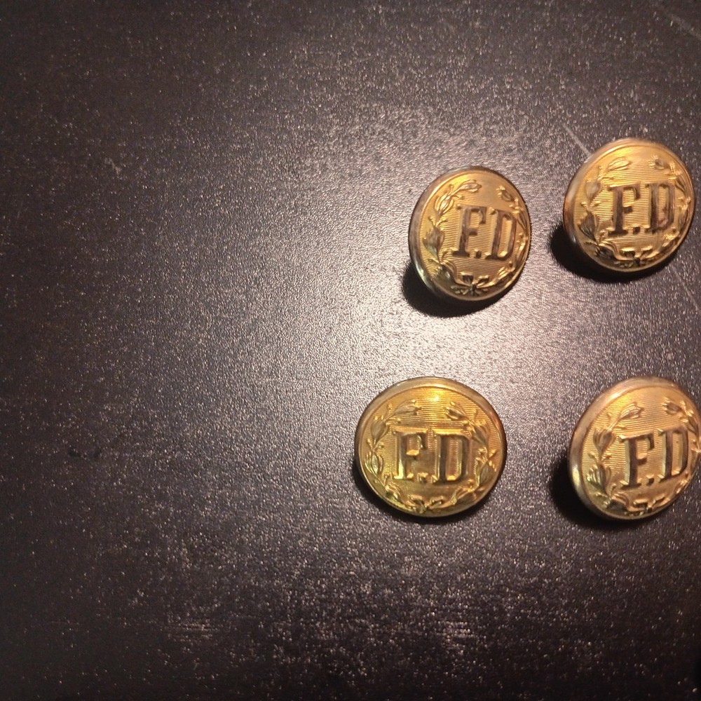 Fire department brass uniform buttons