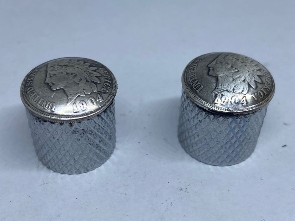 Silver toned Indian penny guitar knobs with knurled sides.