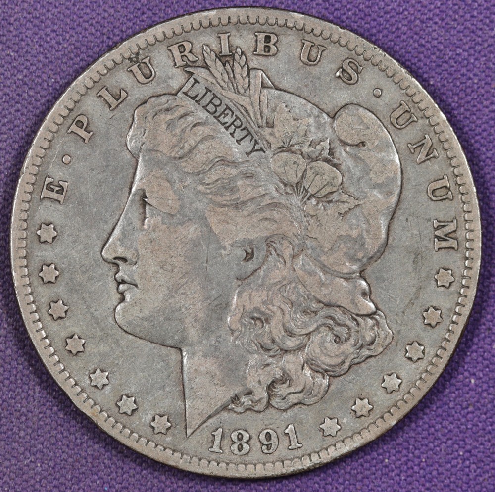 1891-o Morgan Silver Dollar.  Clashed "E" Under Eagles Tail, Reverse. VF. 196278