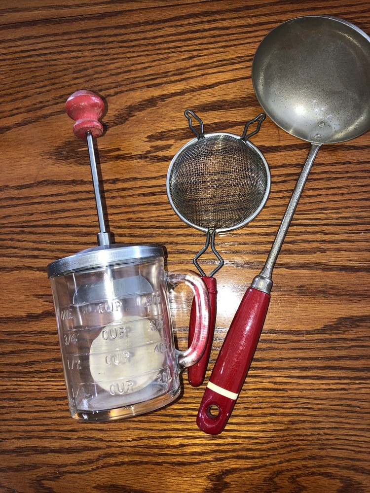 Vintage  red handle measuring cup/chopper and two red handle utensils!