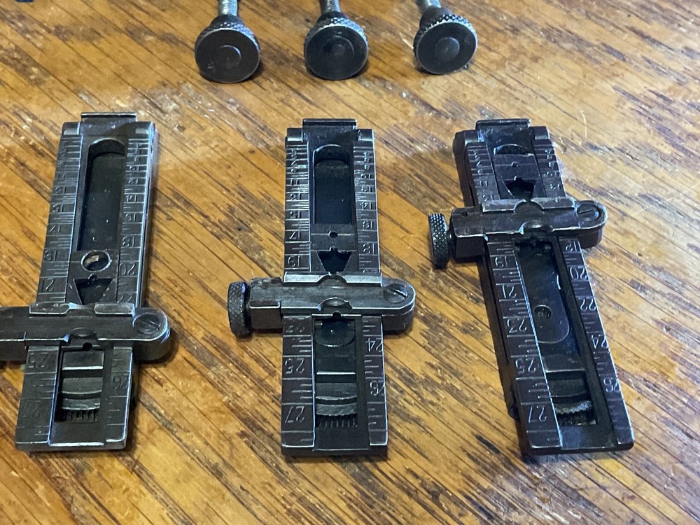 Remington 1903 sight base, leaf, slide, elevation, windage knobs marked R. 1 set