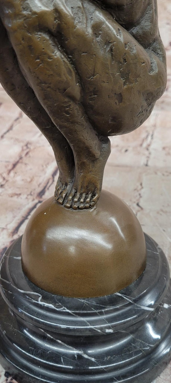 Abstract Bronze Male Figure Balancing on Sphere with Outstretched Arms Sculpture
