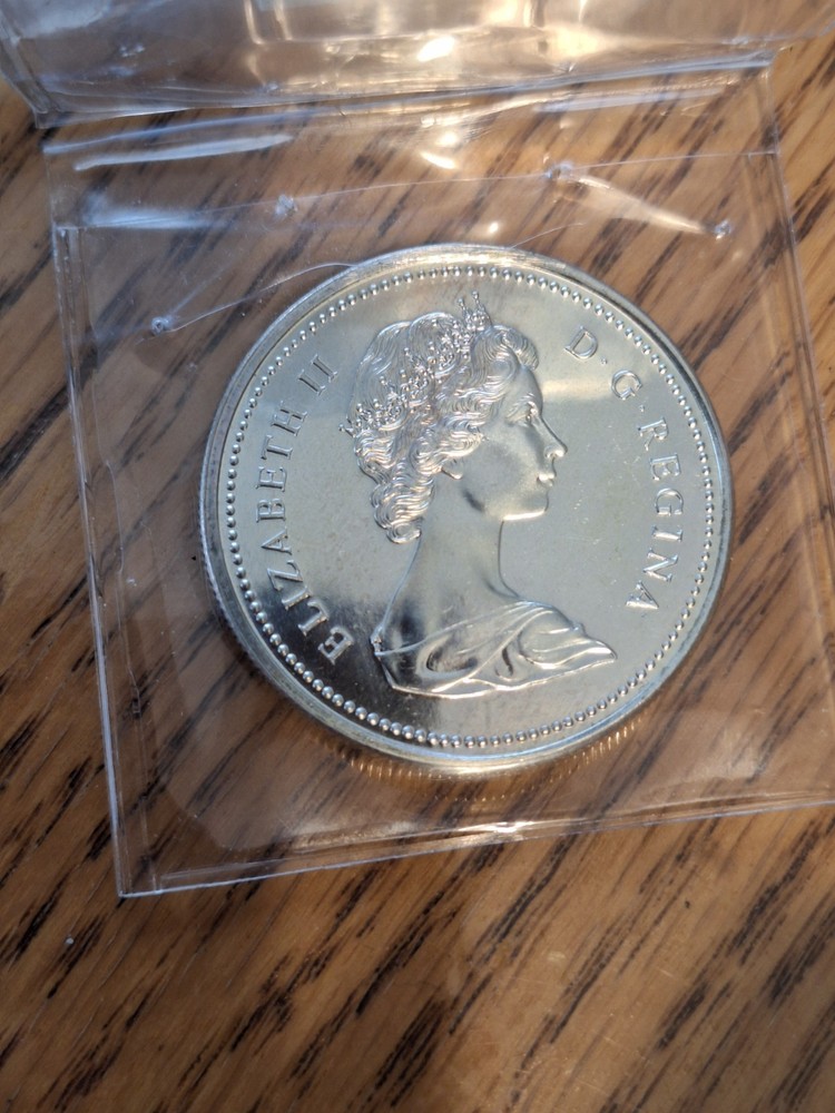 Rainbow Toned 1973 Canada RCMP Uncirculated Silver Dollar