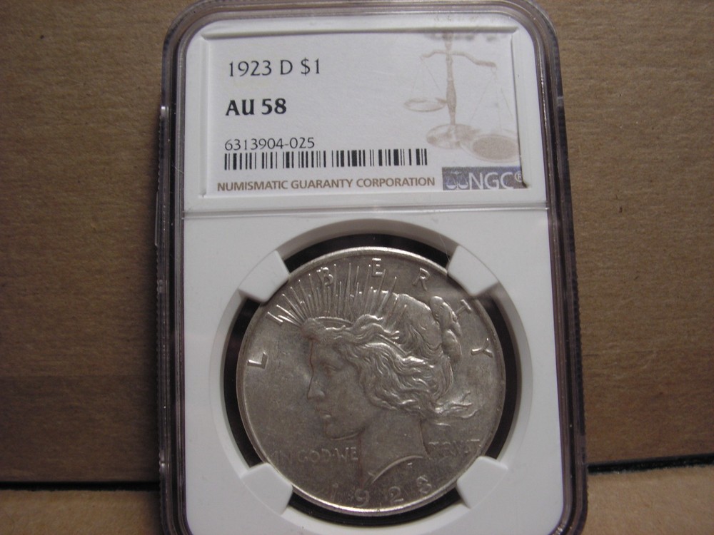 1923 - D Peace Silver Dollar. NGC AU58,