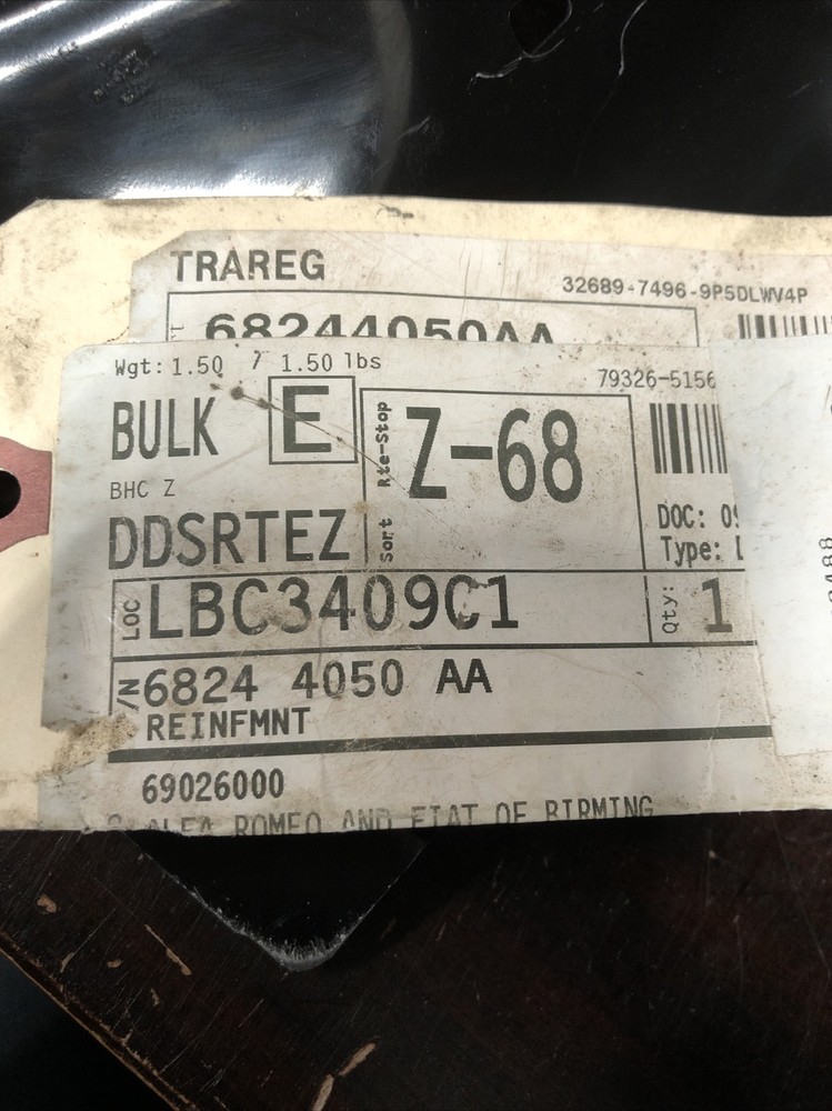 New Old Stock Unbranded Back Panel Bracket Part #68244050AA.