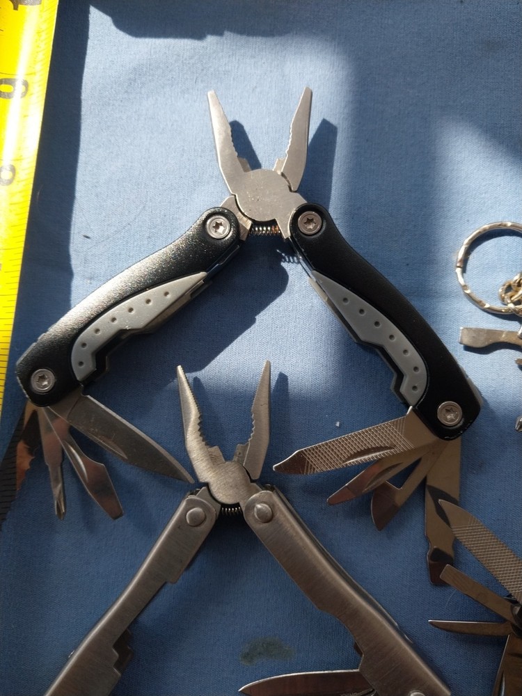 4 small multitudes with pliers knife scissors screwdriver's