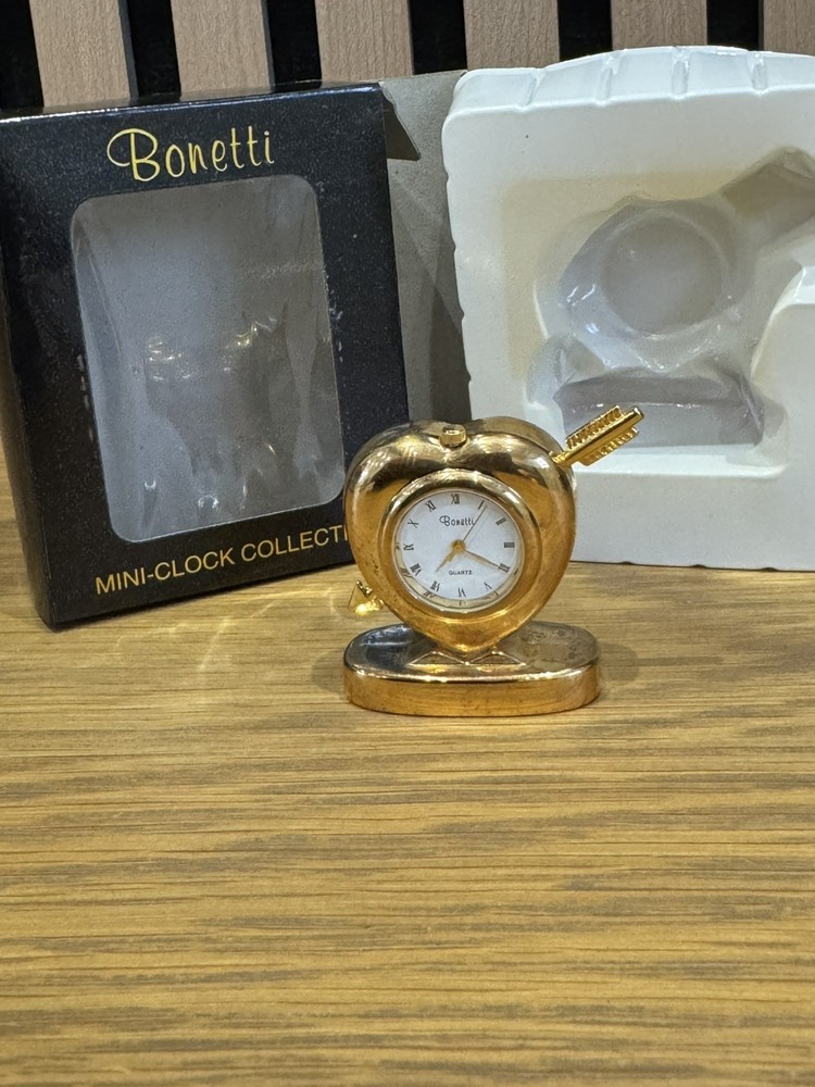 Bonetti Clock Collection comprising 7 boxed gold finished analogue mini-clocks