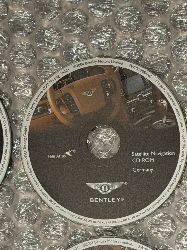 2004 Bentley Continental GT 7 Navigation Disc Set & Bentley Disc Case.