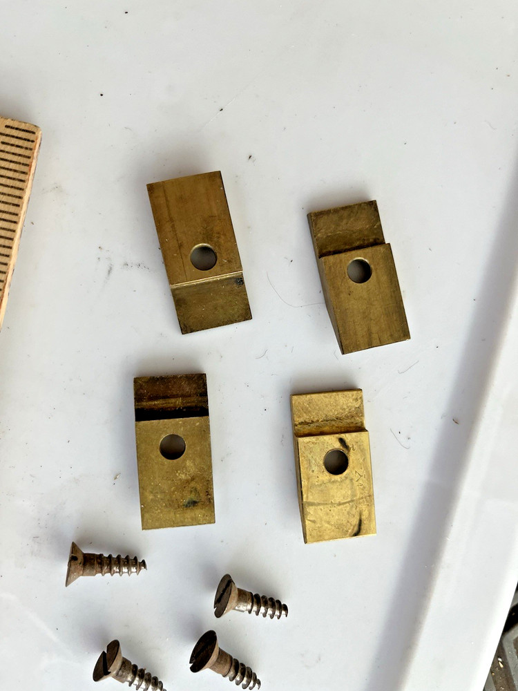 4 original E Howard large movement mounting brass clips