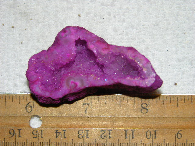 Geode cut & polished half with colored crystal center 2 inch E18