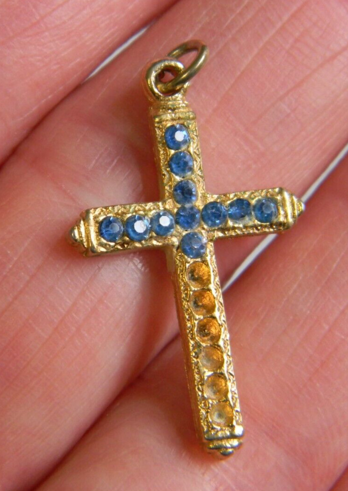 Religious gold tone missing blue stones cross pendant