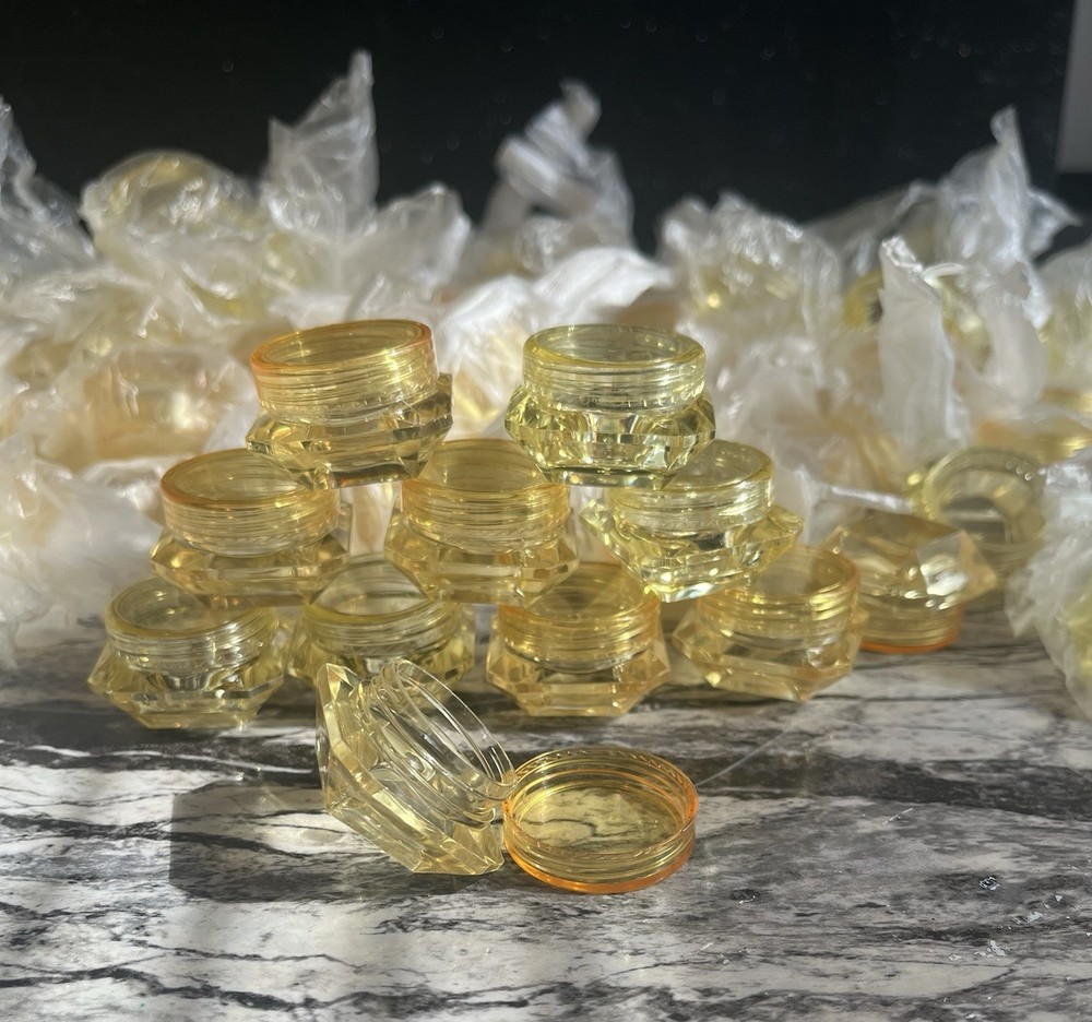 Yellow refillable diamond shaped bottles