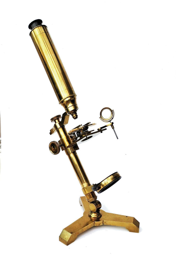 Brass microscope in case.