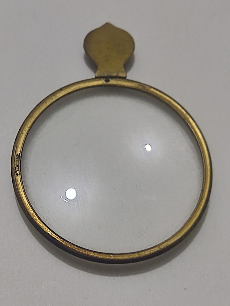 Antique magnifying glass.