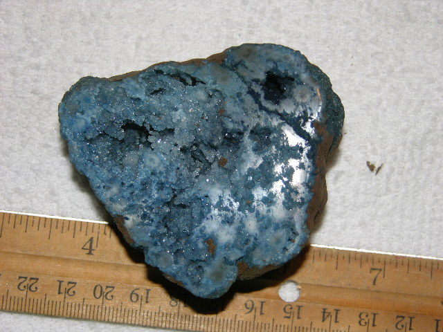 Geode cut & polished half with colored crystal center 3 inch E39