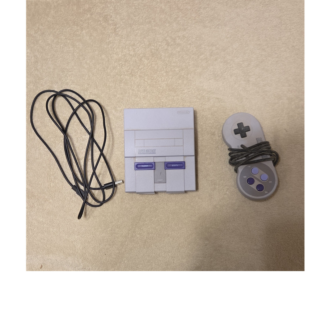 Nintendo SNES classic with controller and cables