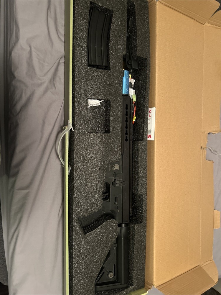 Airsoft AEG Matrix, custom muzzle and comes with Red Dot and irons.