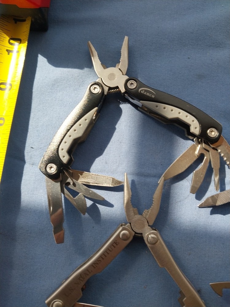 4 small multitudes with pliers knife scissors screwdriver's