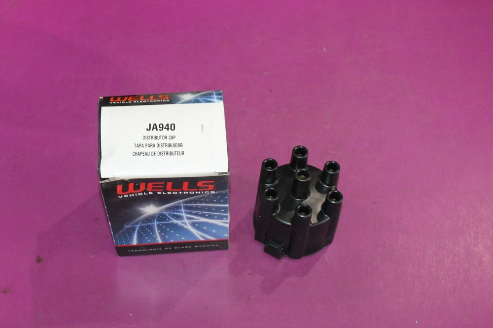 NOS Wells Distributor Cap. Part JA940. See pic.