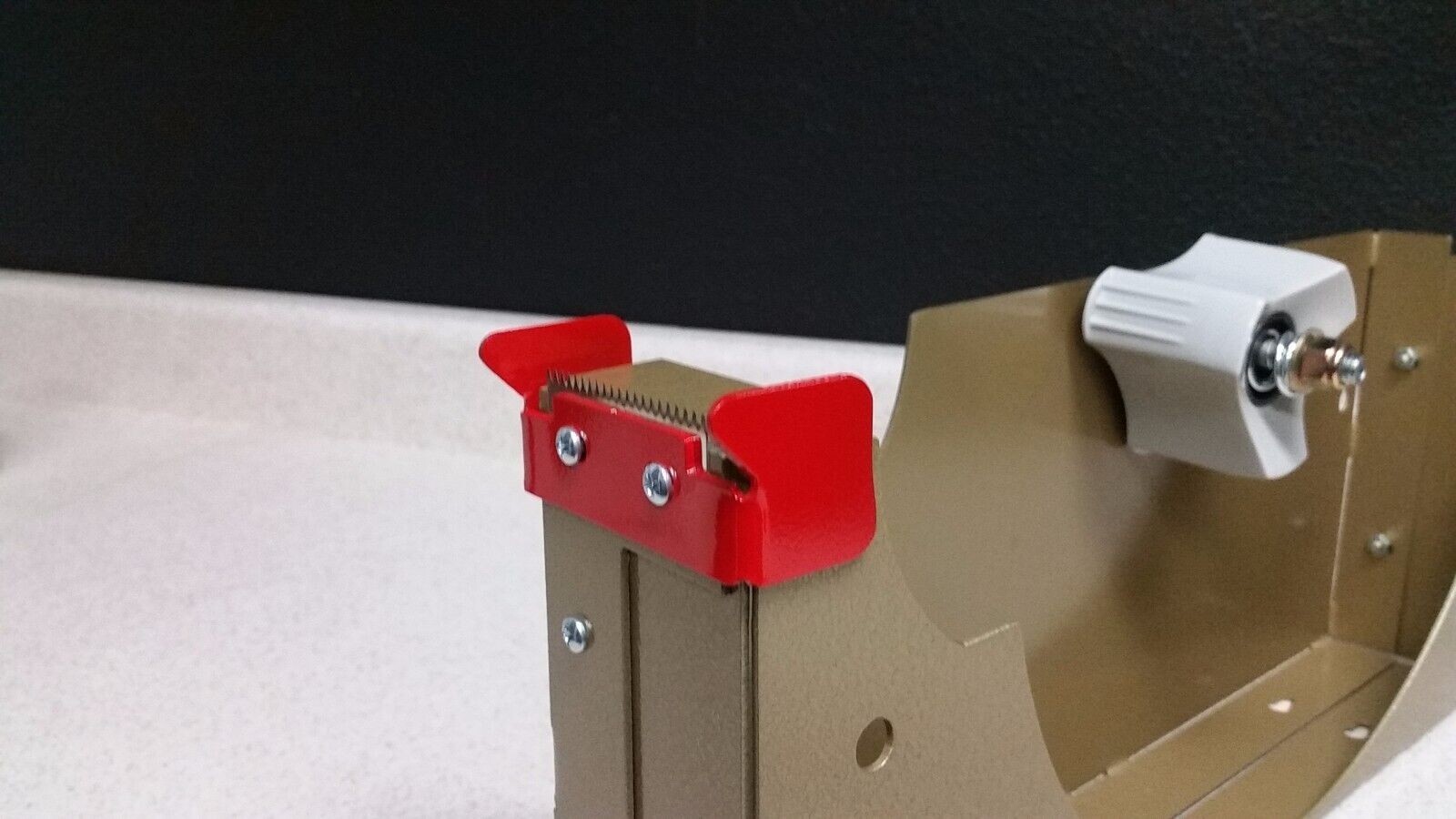 10 inch tape dispenser 2" wide 3" core. Packaging tape dispenser commercial duty