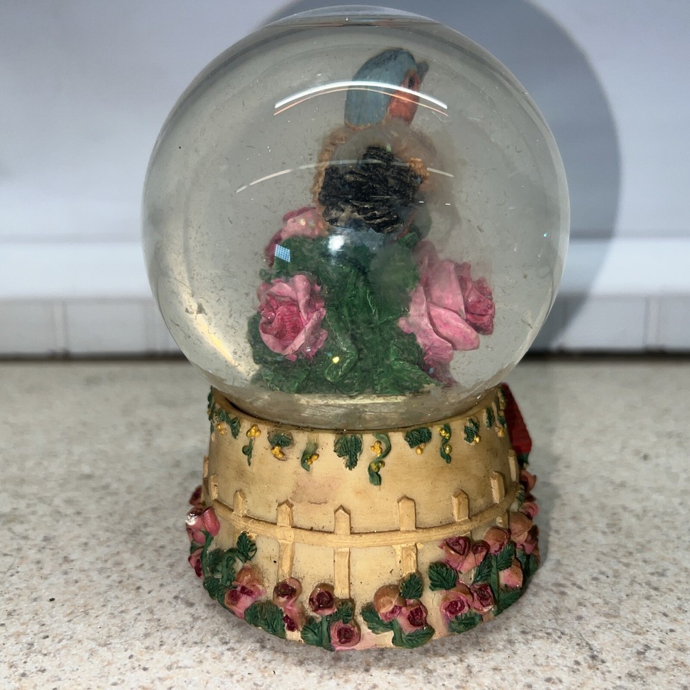 Vintage bird snow globe