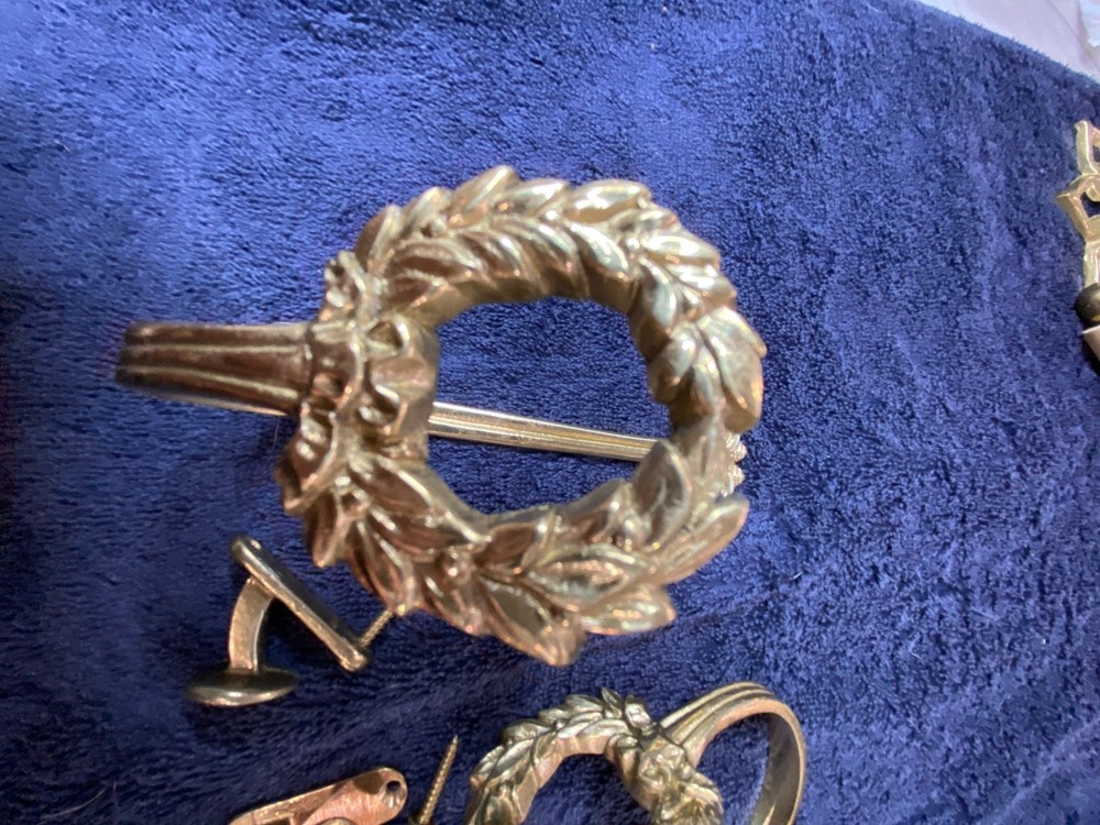 Ornate vintage brass drape tie-backs.