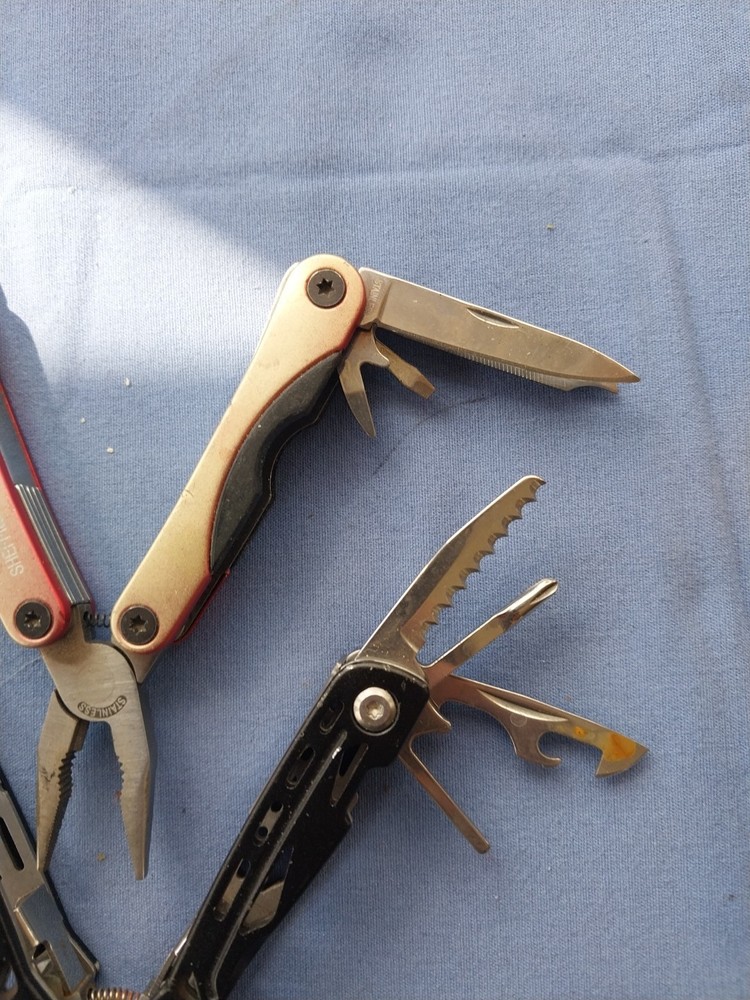 4 small multitudes with pliers knife scissors screwdriver's