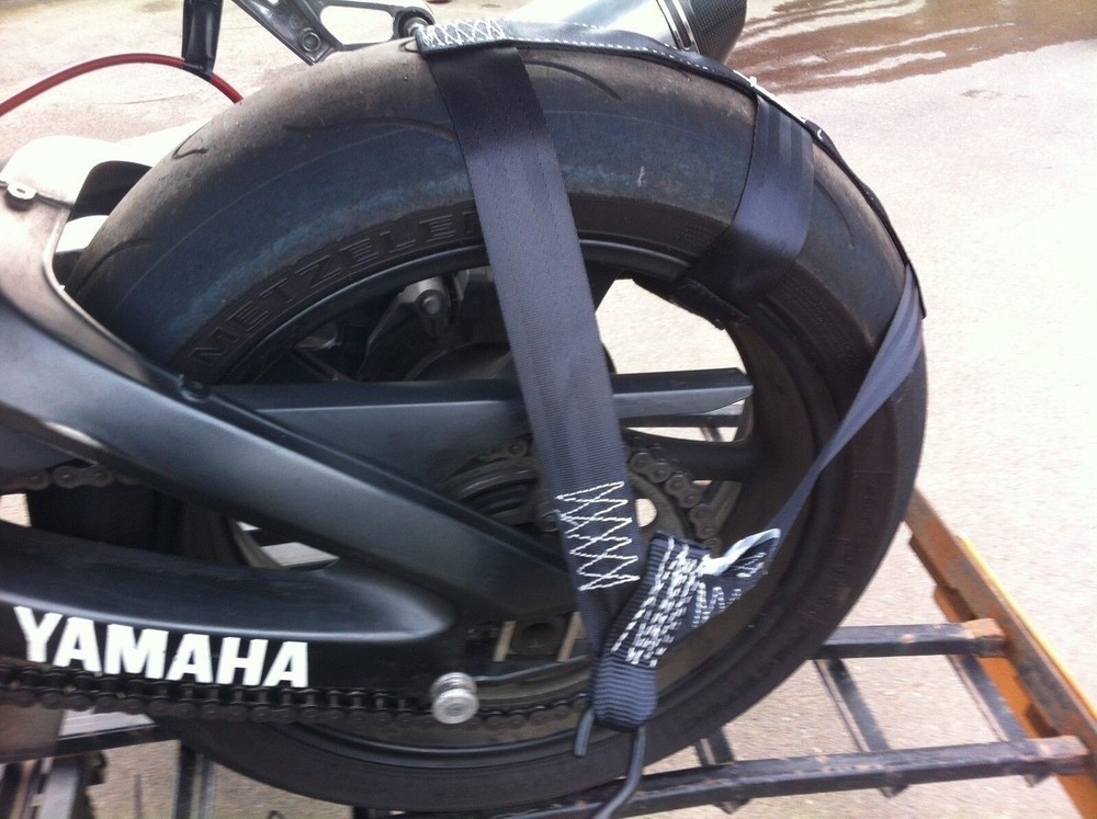 Rear wheel tie-down strap
