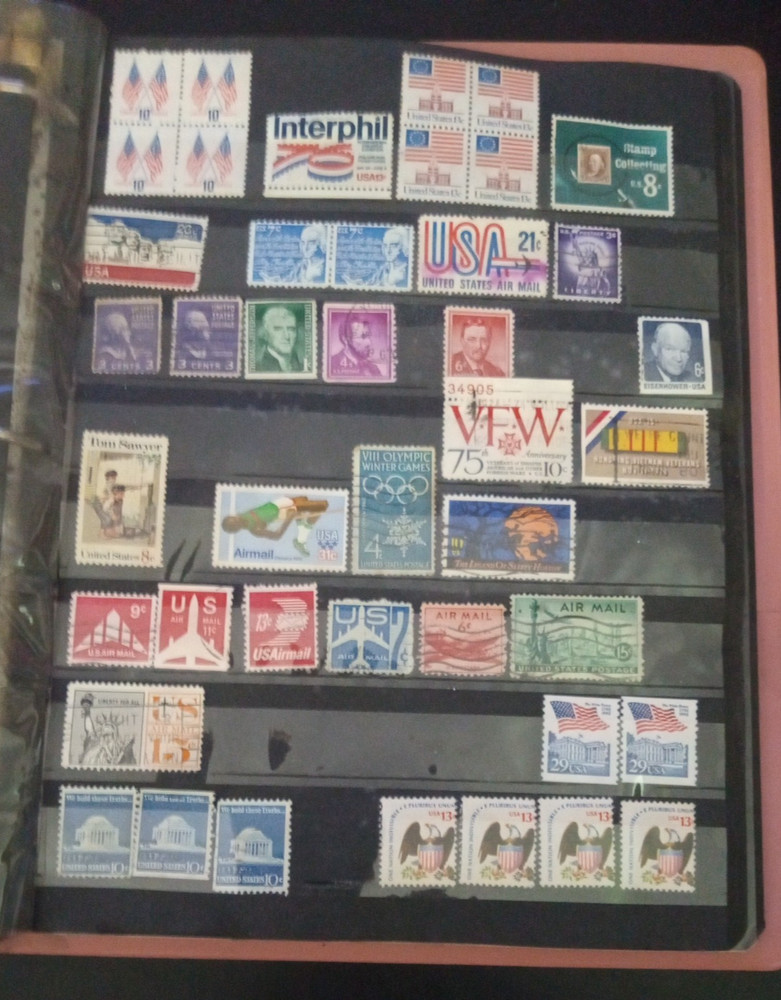 2" 3 ring binder w/ 5 pages of stamps over 100 usable stamps mostly US