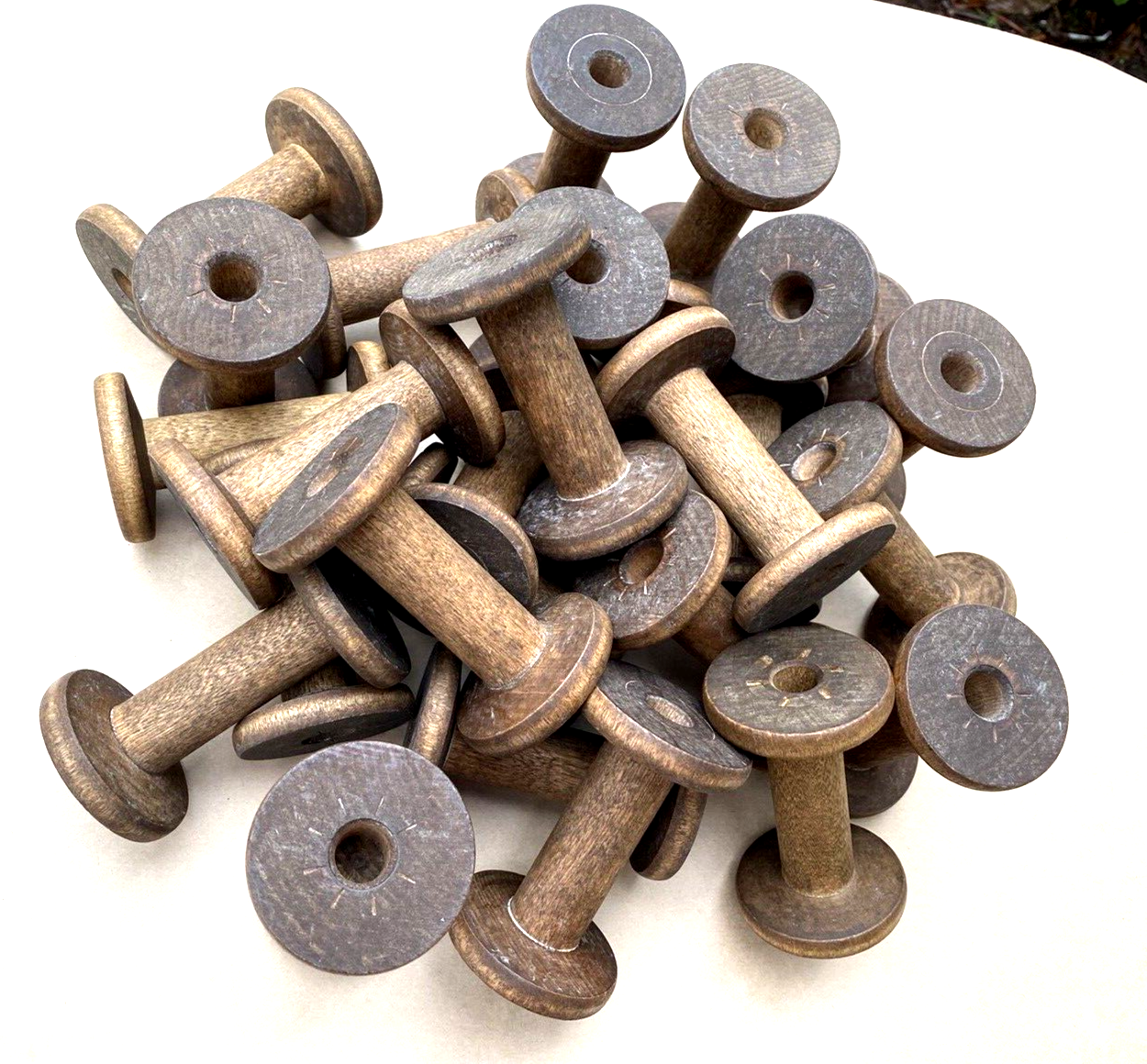 A Lot of Twenty Five 4 Inch Wooden Silk Spools