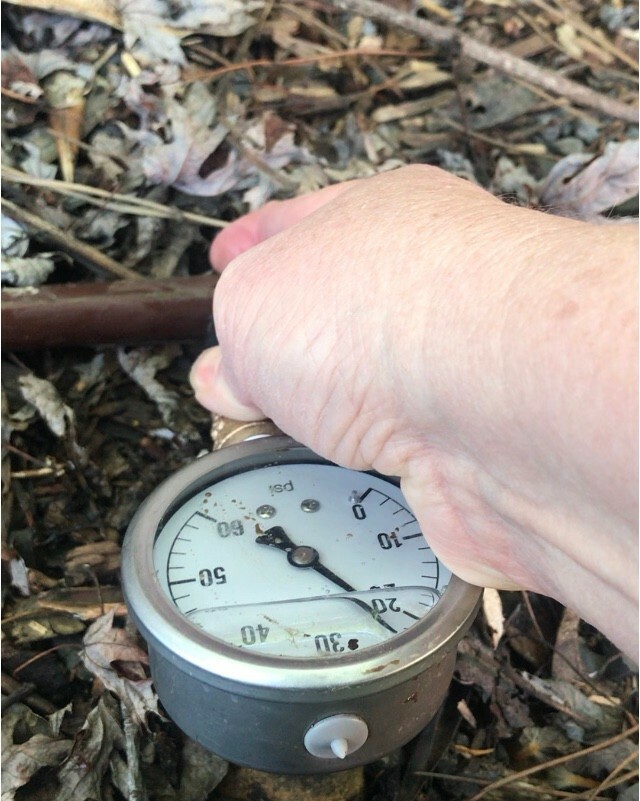 Drip irrigation pressure testing tool with 60 psi liquid filled gauge.