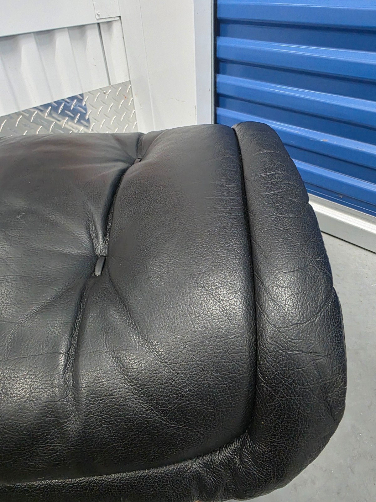 Ekornes Stressless Black Colored Leather Ottoman | Teak Stained Wood Base