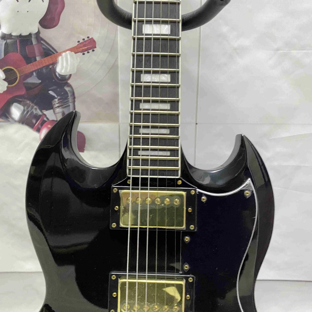 Black 6-string electric guitar with HH pickup, gold hardware, solid body