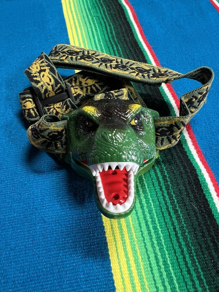 The DinoBryte LED Headlamp T-Rex Dinosaur Hook And Loop Sound Roars EUC