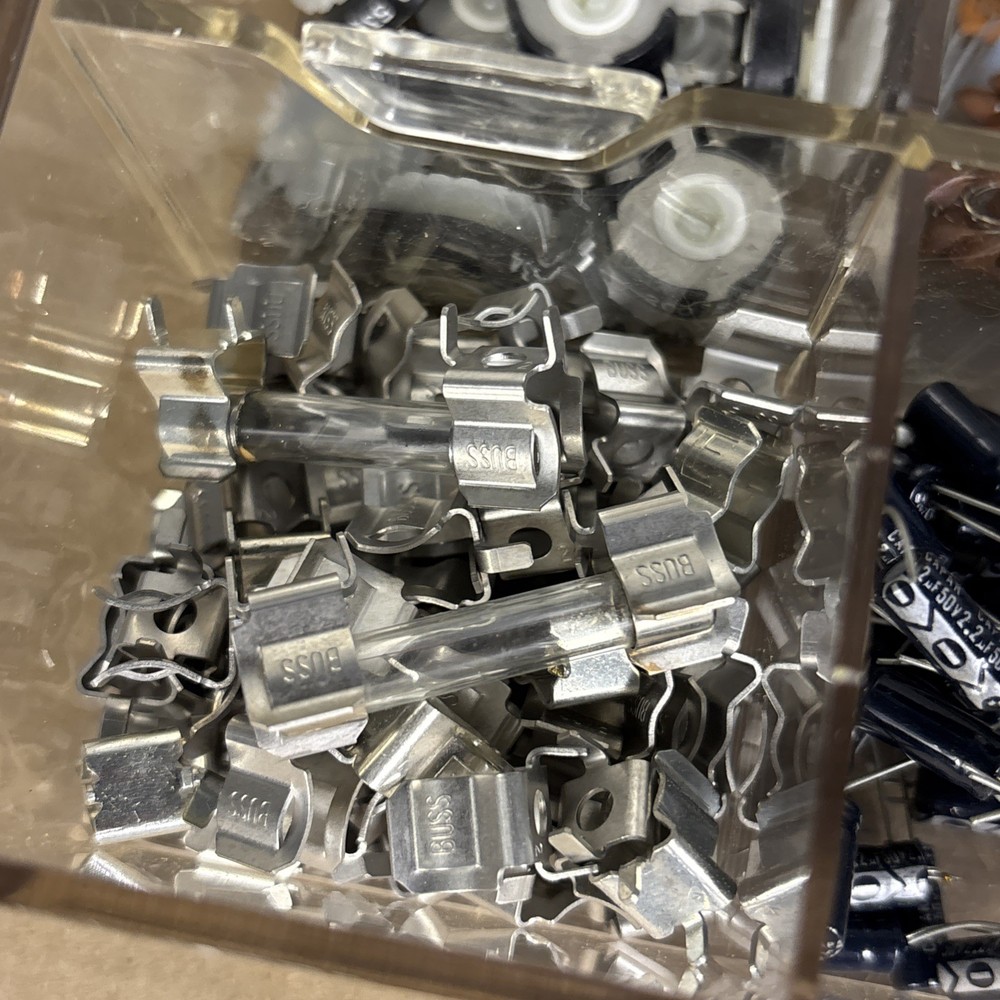 assorted electronics components, parts in a compartment box, NOS capacitors, etc