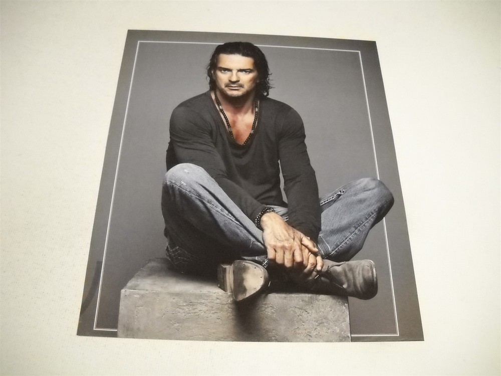 RICARDO ARJONA sits cross-legged and casual Original 2011 Promo Display Ad