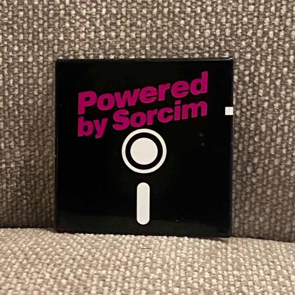 Vintage Powered by Sorcim Pinback Button Floppy Disk Software Tech Advertising
