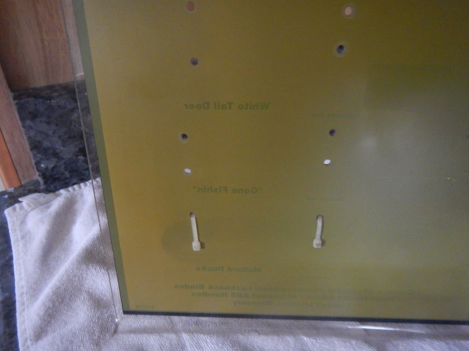 Vintage Sabre scrimshaw knife counter top store display with one NOS knife