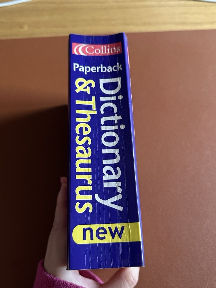 Paperback dictionary and thesaurus by Collins