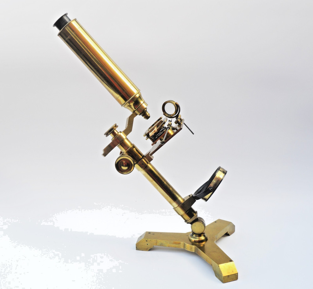 Brass microscope in case.