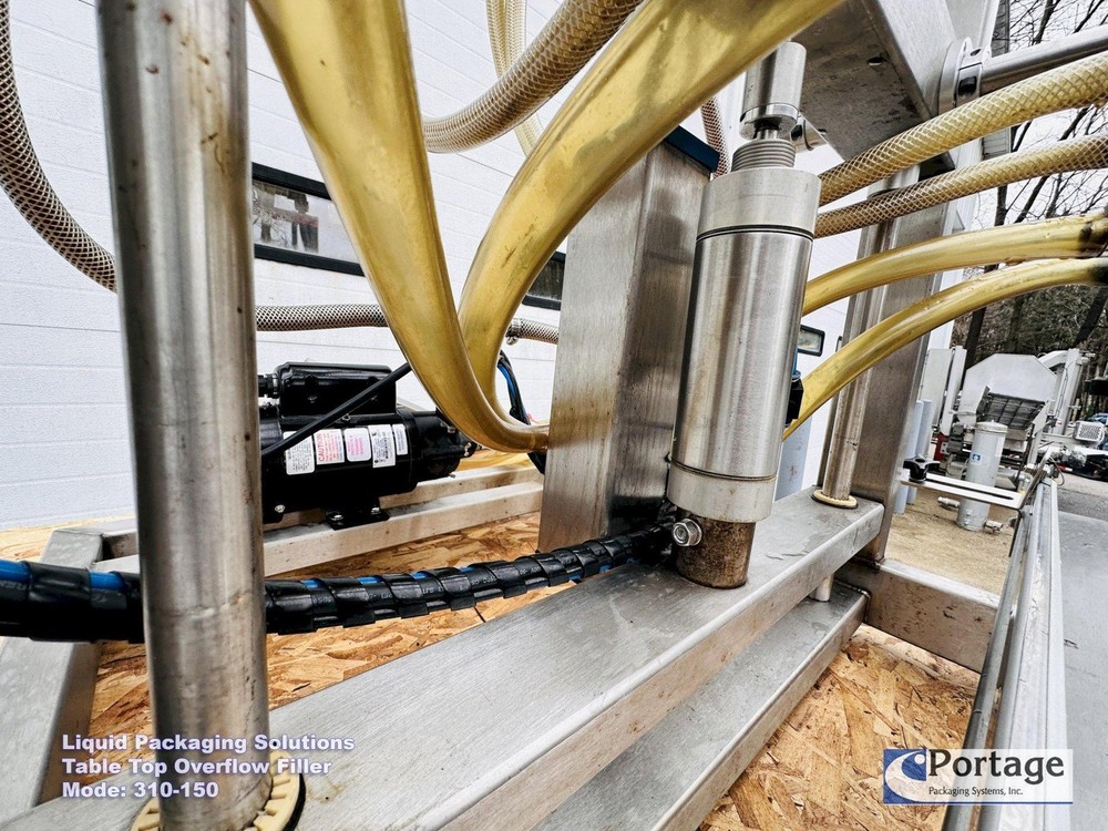 Liquid Packaging Solutions Model: 310-150 || Semi-Automatic Table Top Overflow