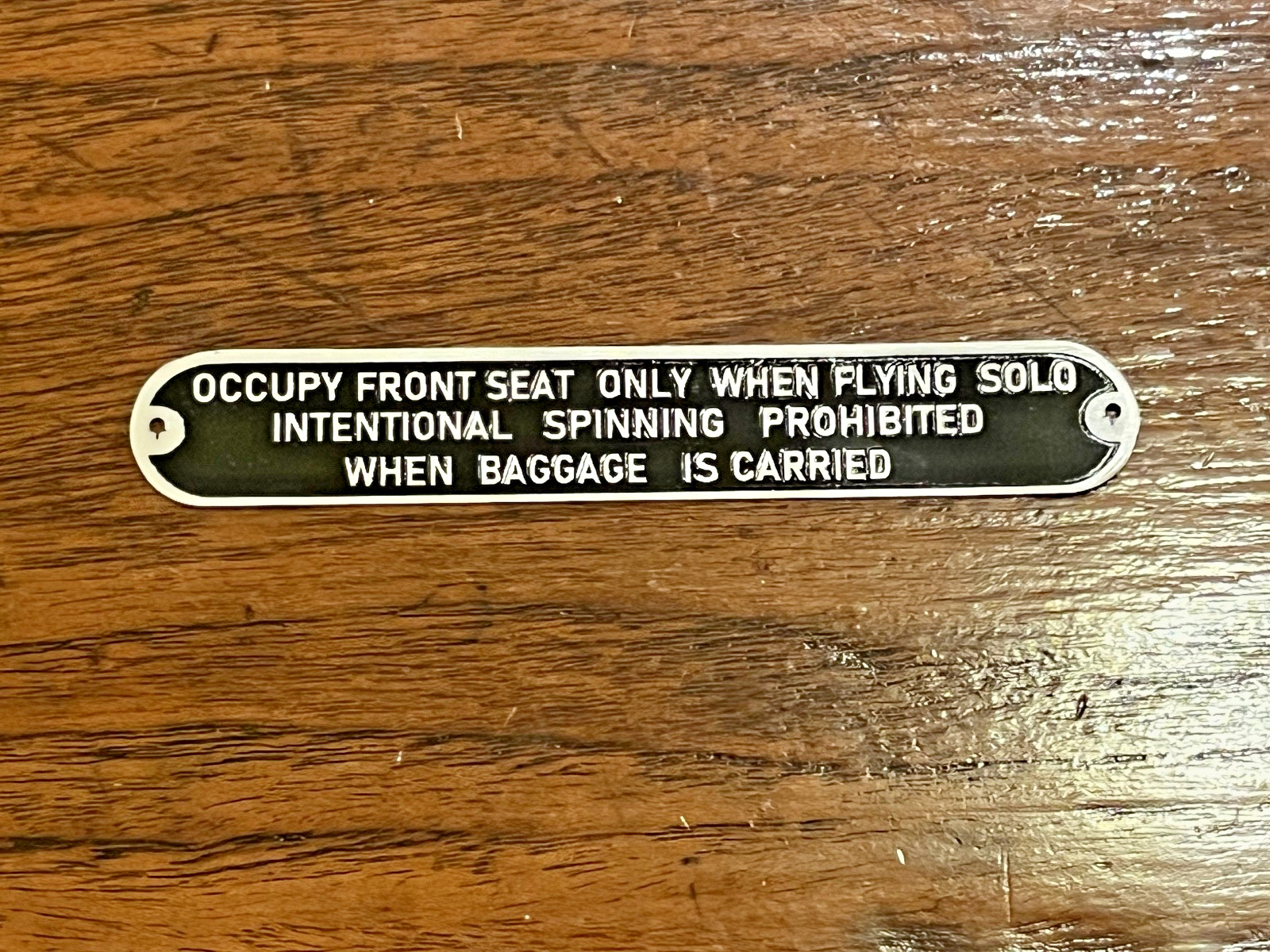 Aeronca Style "OCCUPY FRONT SEAT ONLY WHEN FLYING SOLO, INTENTIONAL SPINNING..."