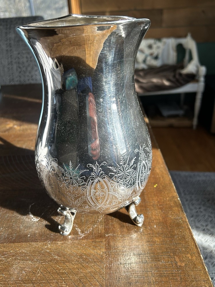 Vintage Leonard silver-plated pitcher with engraved floral pattern.
