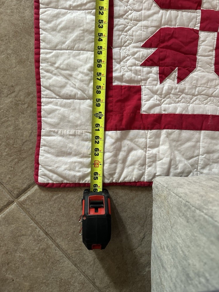 Cutters handmade red and white "Bear Paw" pattern quilt.