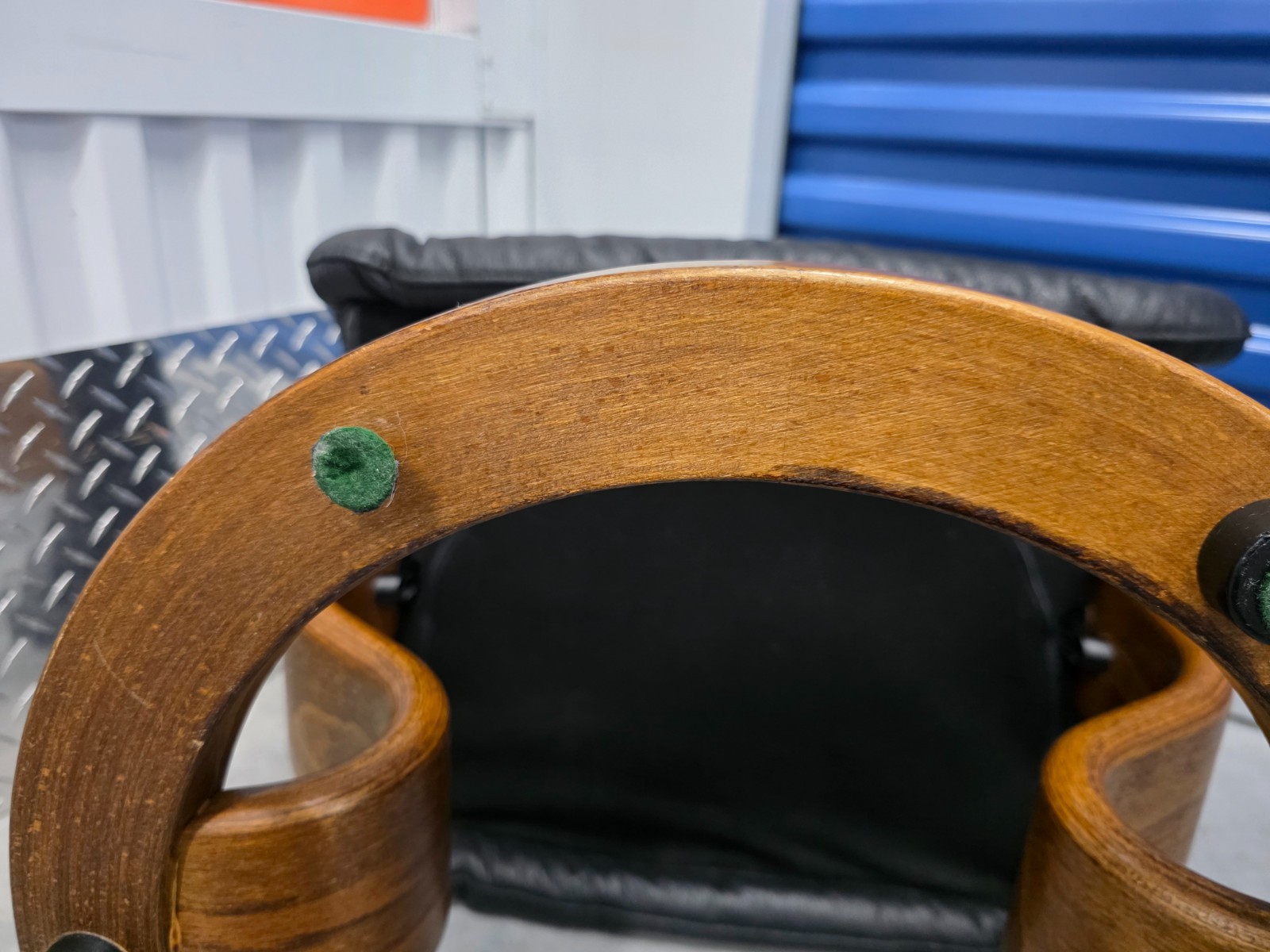 Ekornes Stressless Black Colored Leather Ottoman | Teak Stained Wood Base